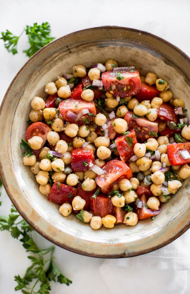 tomato chickpea salad in stoneware bowl