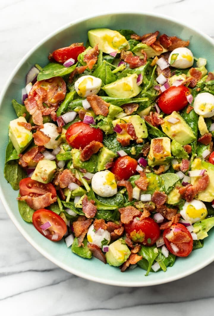 a bowl of avocado bacon salad