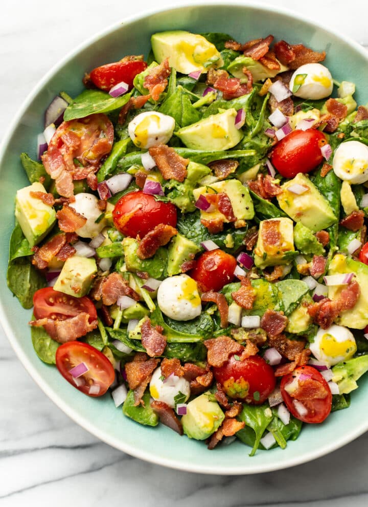 a bowl of avocado bacon salad