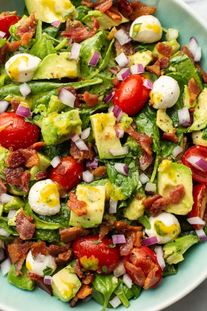 closeup of a bowl of avocado bacon salad