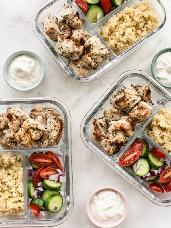 This easy Greek grilled chicken meal prep bowl recipe makes healthy lunches for the week! Quinoa, vegetables, and plenty of garlic make these bowls really tasty. 