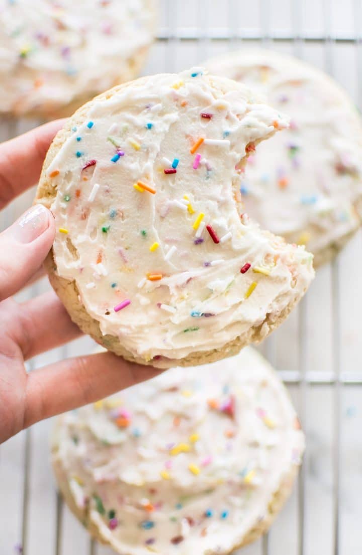 close-up of funfetti cookie with a bite in it