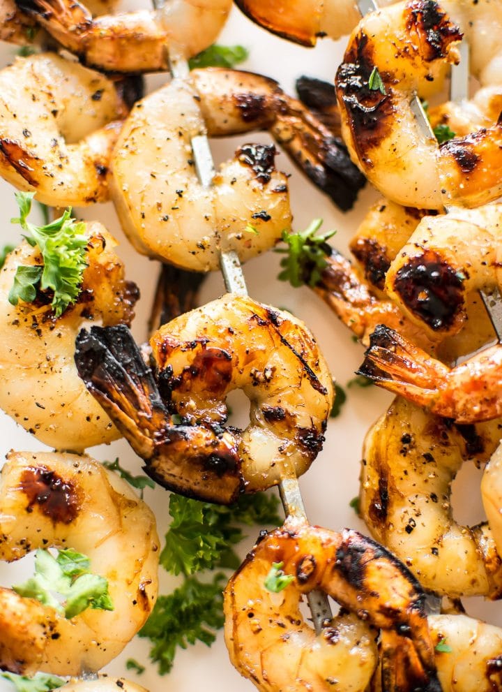 These grilled honey garlic shrimp skewers are quick, delicious, and only take 15 minutes to marinate. They're sure to be a hit this summer! 