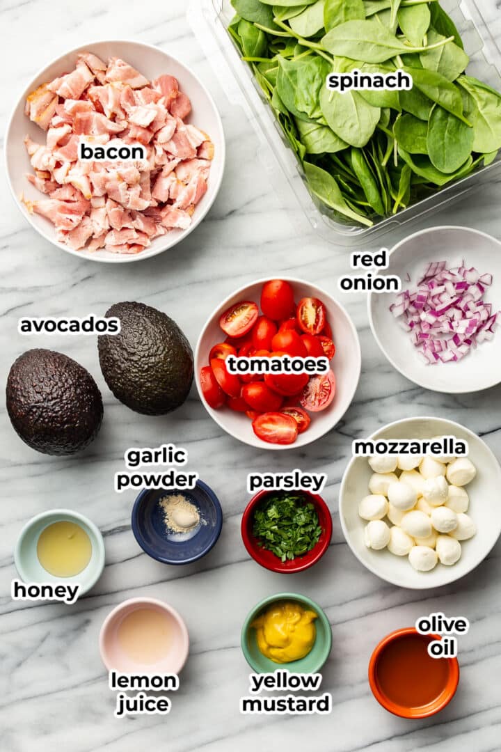 ingredients for avocado bacon salad in prep bowls
