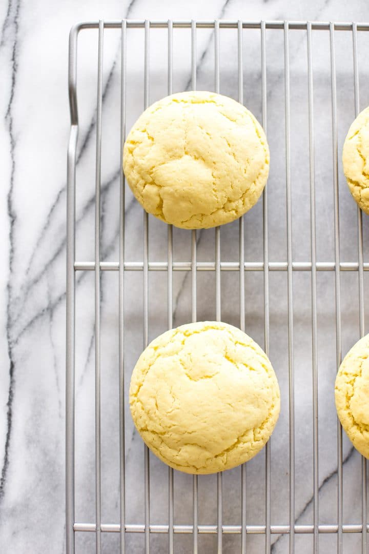 chewy lemon cookies on a wire cooling rack
