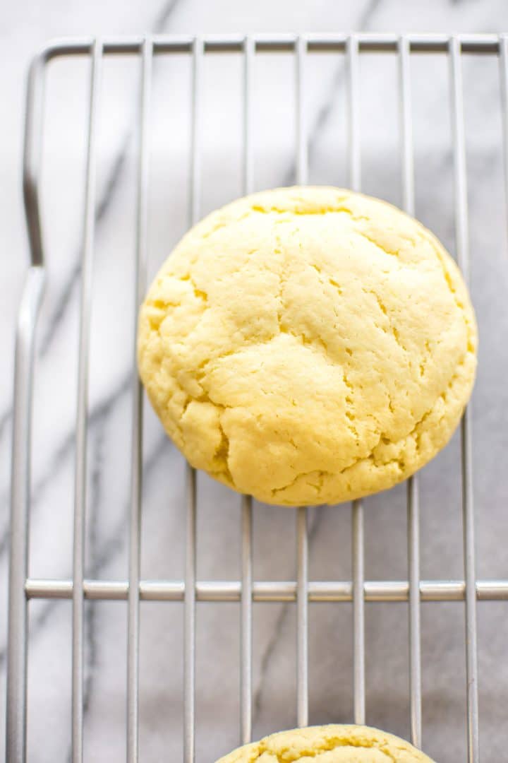 close-up of a lemon cookie on a wire cooling rack