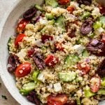 This healthy Greek quinoa salad is simple, easy to make, and delicious! The lemony vinaigrette dressing is light and flavorful. You can easily make the salad vegan by taking out the feta cheese.