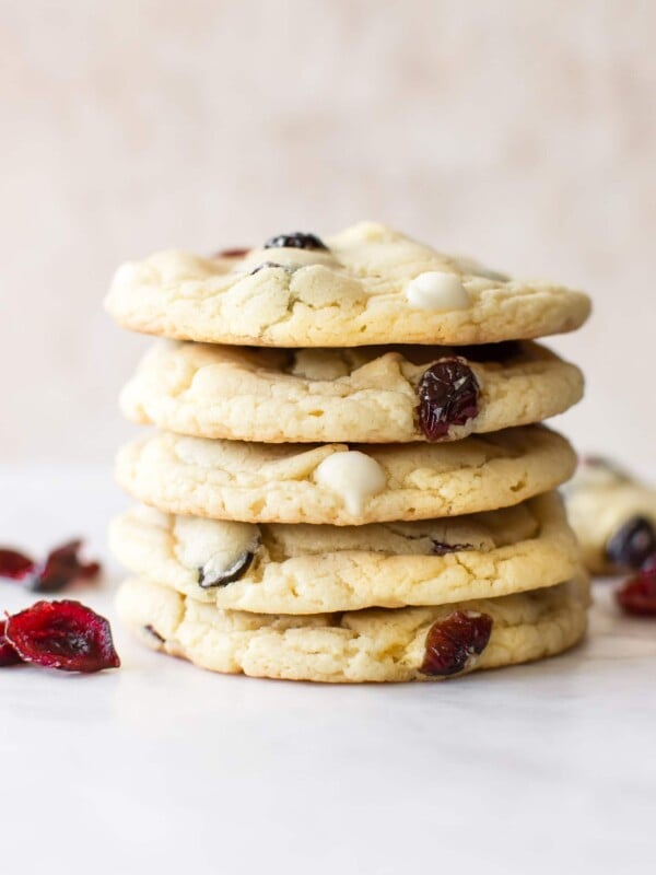 These easy white chocolate cranberry cookies are perfect for Christmas. Bake these for a holiday party or cookie exchange! They're made using yellow cake mix, so they're simple and take way less time than baking from scratch.