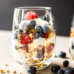 These berry yogurt parfaits are a quick, easy, and delicious breakfast that you can make ahead in mason jars. Perfect for kids or meal prep breakfasts on the go. 