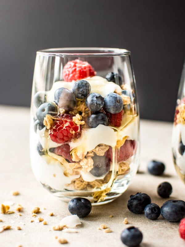 These berry yogurt parfaits are a quick, easy, and delicious breakfast that you can make ahead in mason jars. Perfect for kids or meal prep breakfasts on the go. 