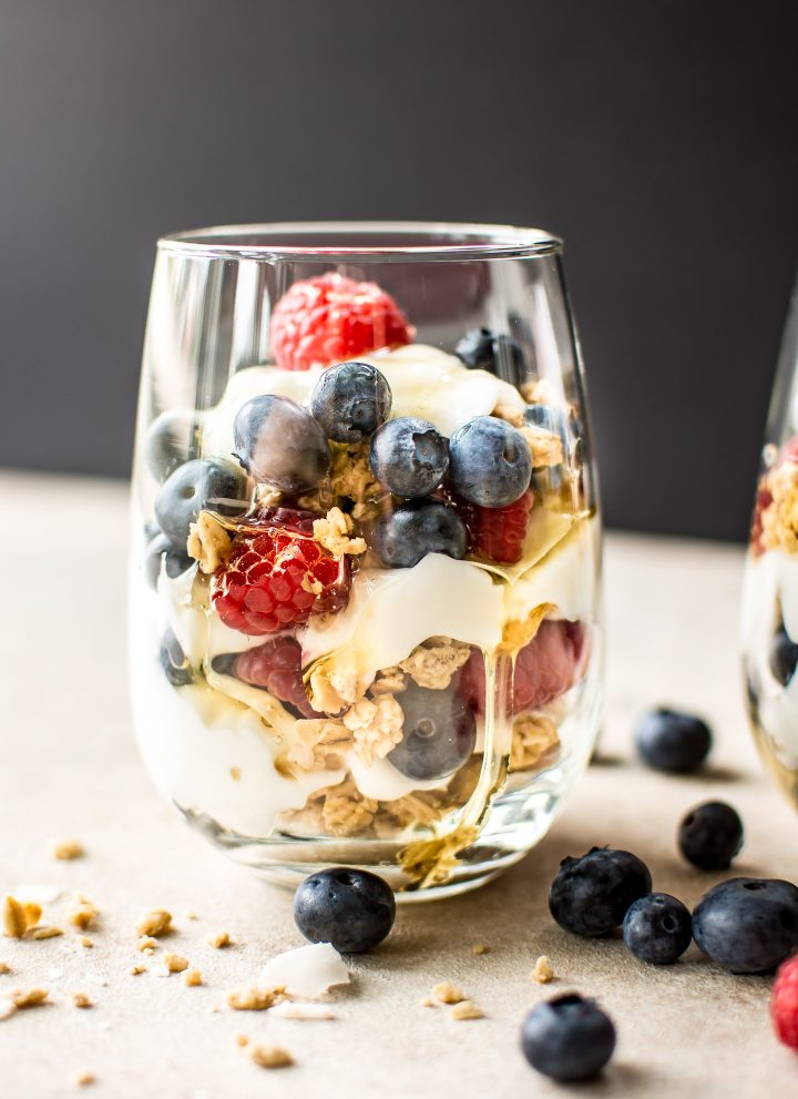 These berry yogurt parfaits are a quick, easy, and delicious breakfast that you can make ahead in mason jars. Perfect for kids or meal prep breakfasts on the go. 