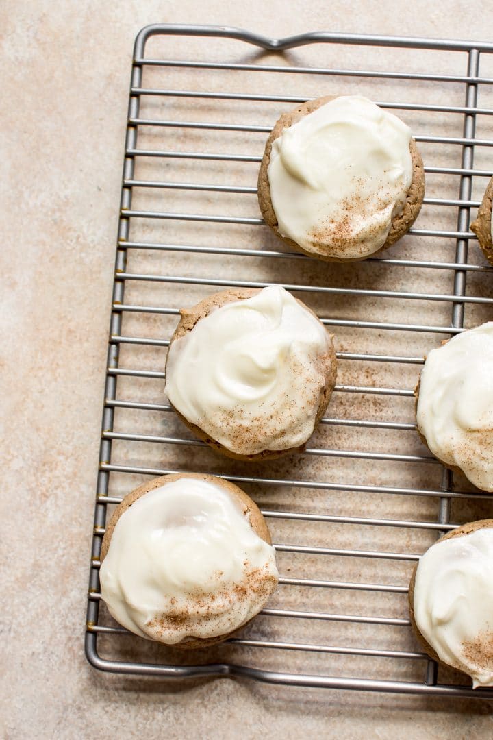 carrot cake cookies with cream cheese frosting on a wire rack