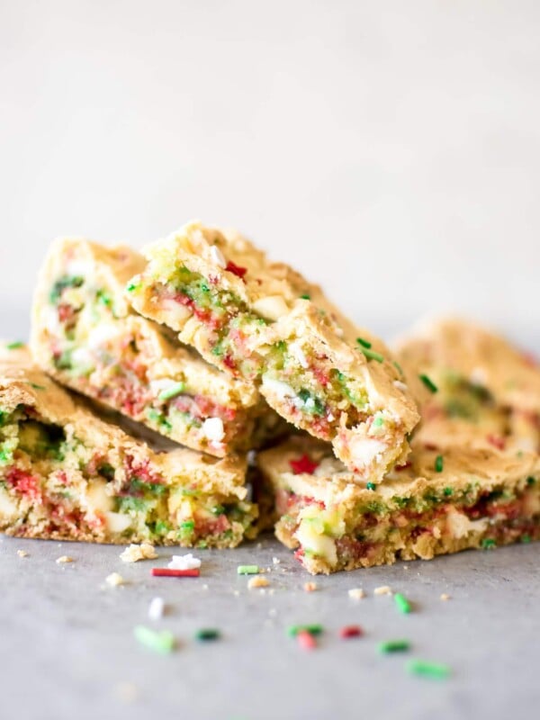 Easy Christmas cake batter blondies make holiday baking simpler! A perfect sweet treat that the whole family will love. You can bring these bars to Christmas parties or cookie exchanges, and kids will love them.