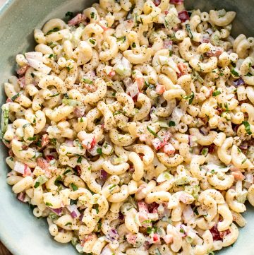This classic macaroni salad is super easy to make! It's the best old fashioned creamy potluck salad. It has a vegetarian base that's perfect for adding extra protein if needed.
