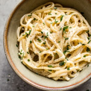 This easy creamy garlic pasta recipe is a fast and tasty weeknight comfort food dinner!