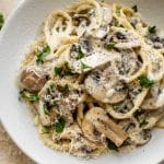 This creamy mushroom pasta recipe has plenty of garlic, white wine, butter, lemon juice, and cremini mushrooms. A delicious vegetarian entree that's perfect for dinner parties.