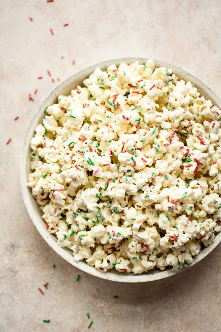 bowl of white chocolate popcorn with festive sprinkles