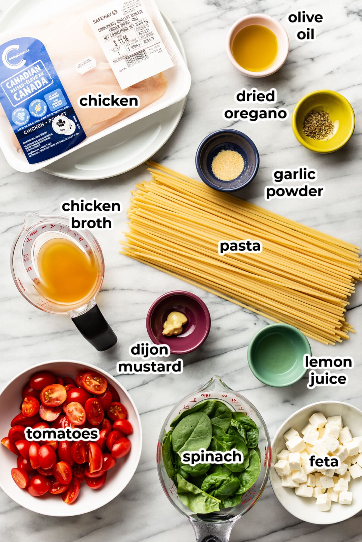 ingredients for chicken feta spinach pasta in prep bowls