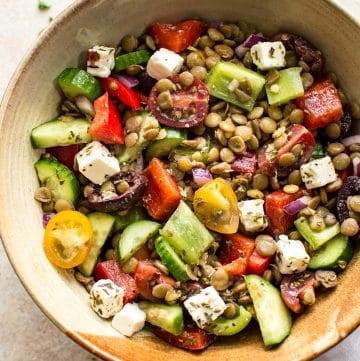 This Mediterranean lentil salad is easy and healthy! It's full of vegetables and plenty of feta. You'll love the tangy vinaigrette dressing. This salad is perfect for a summer lunch!