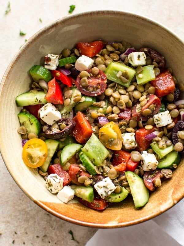 This Mediterranean lentil salad is easy and healthy! It's full of vegetables and plenty of feta. You'll love the tangy vinaigrette dressing. This salad is perfect for a summer lunch!