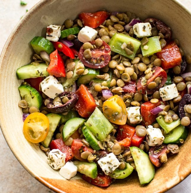 This Mediterranean lentil salad is easy and healthy! It's full of vegetables and plenty of feta. You'll love the tangy vinaigrette dressing. This salad is perfect for a summer lunch!