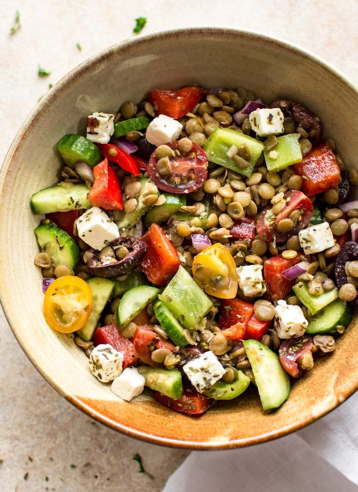 This Mediterranean lentil salad is easy and healthy! It's full of vegetables and plenty of feta. You'll love the tangy vinaigrette dressing. This salad is perfect for a summer lunch!