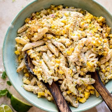 This easy Mexican street corn pasta salad is the perfect vegetarian grilled corn recipe to serve at summer BBQs, parties, or potlucks. The spicy chipotle lime dressing comes together fast, and eating the corn off the cob makes this authentic dish so much easier for a crowd to enjoy.