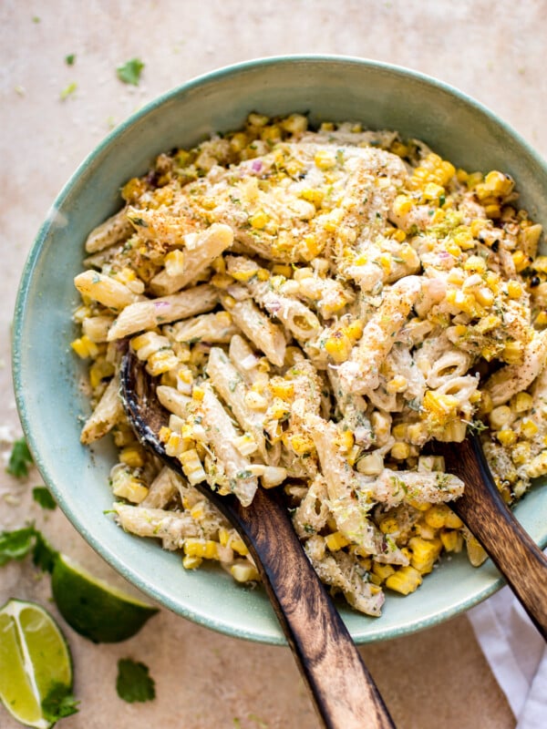 This easy Mexican street corn pasta salad is the perfect vegetarian grilled corn recipe to serve at summer BBQs, parties, or potlucks. The spicy chipotle lime dressing comes together fast, and eating the corn off the cob makes this authentic dish so much easier for a crowd to enjoy.