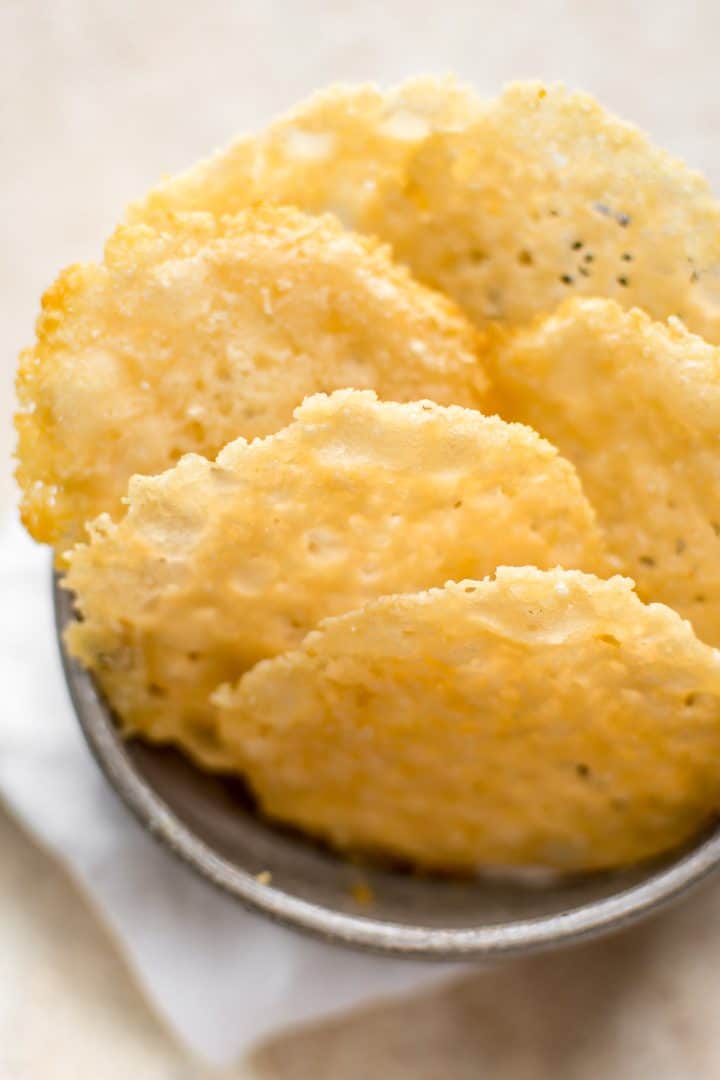 close-up of parmesan cheese crisps in small bowl