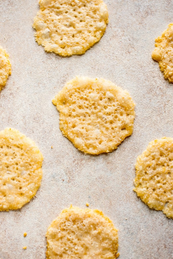 parmesan cheese crisps laid out on a flat surface