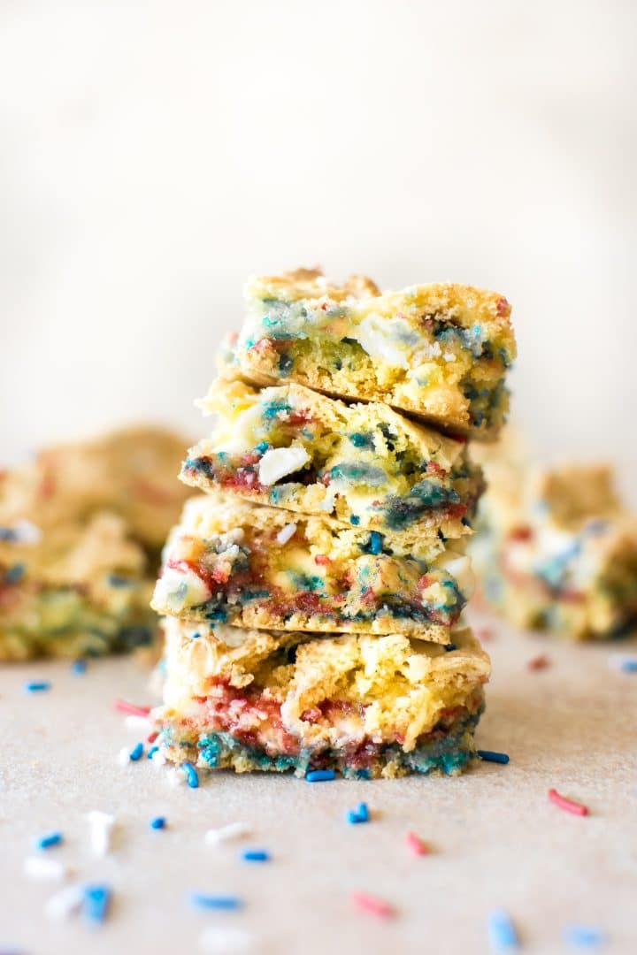 four red, white, and blue patriotic cookie bars in a stack