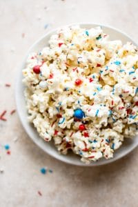 This patriotic marshmallow popcorn is the perfect snack of dessert to feed a crowd on the Fourth of July or Memorial Day! Kids and adults will love it. It's super easy to make.