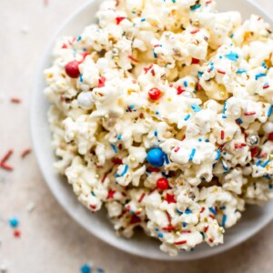 This patriotic marshmallow popcorn is the perfect snack of dessert to feed a crowd on the Fourth of July or Memorial Day! Kids and adults will love it. It's super easy to make. 