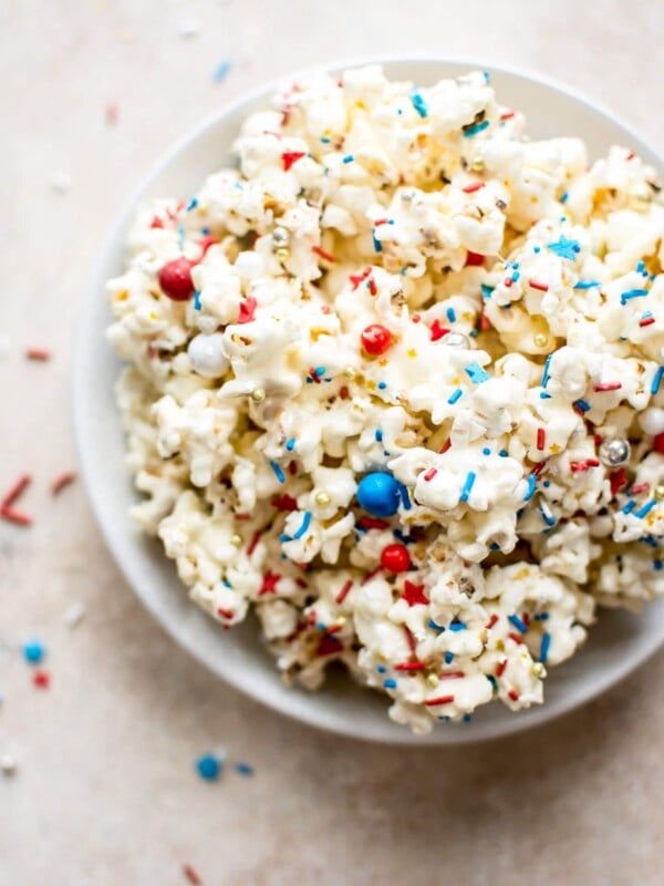 This patriotic marshmallow popcorn is the perfect snack of dessert to feed a crowd on the Fourth of July or Memorial Day! Kids and adults will love it. It's super easy to make. 