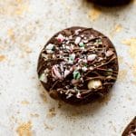 These easy, soft, and chewy peppermint chocolate brownie cookies are topped with crushed candy canes for a festive Christmas treat! They're made from Duncan Hines box mix to save time and effort during the busy holiday season. 