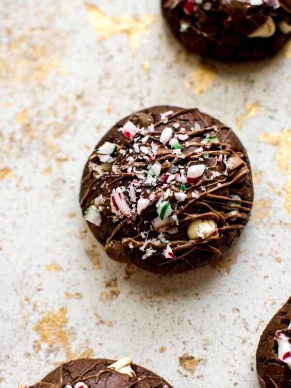 These easy, soft, and chewy peppermint chocolate brownie cookies are topped with crushed candy canes for a festive Christmas treat! They're made from Duncan Hines box mix to save time and effort during the busy holiday season. 