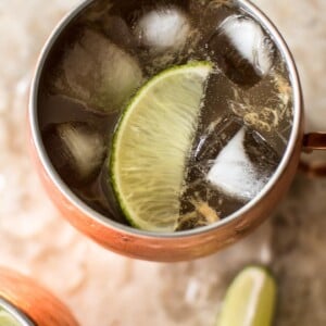 Rhubarb Moscow mule: a summery variation of the classic cocktail. Want to find a way to use up extra rhubarb juice? This is your drink recipe! Perfect for parties.