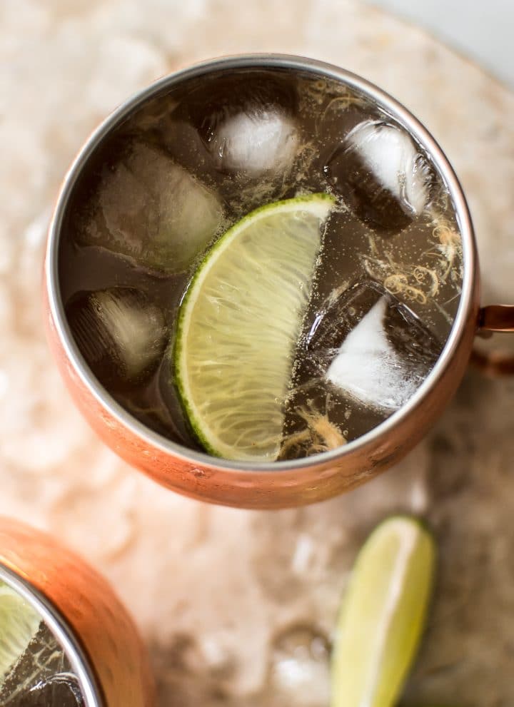 Rhubarb Moscow mule: a summery variation of the classic cocktail. Want to find a way to use up extra rhubarb juice? This is your drink recipe! Perfect for parties.