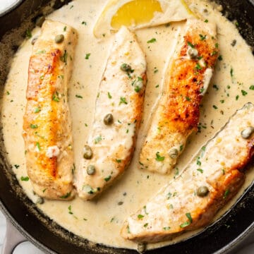 salmon piccata in a cast iron pan