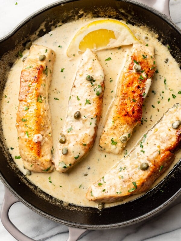 salmon piccata in a cast iron pan