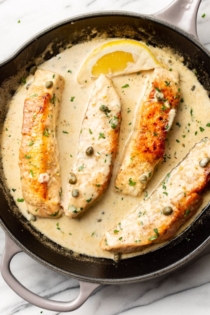 salmon piccata in a cast iron pan