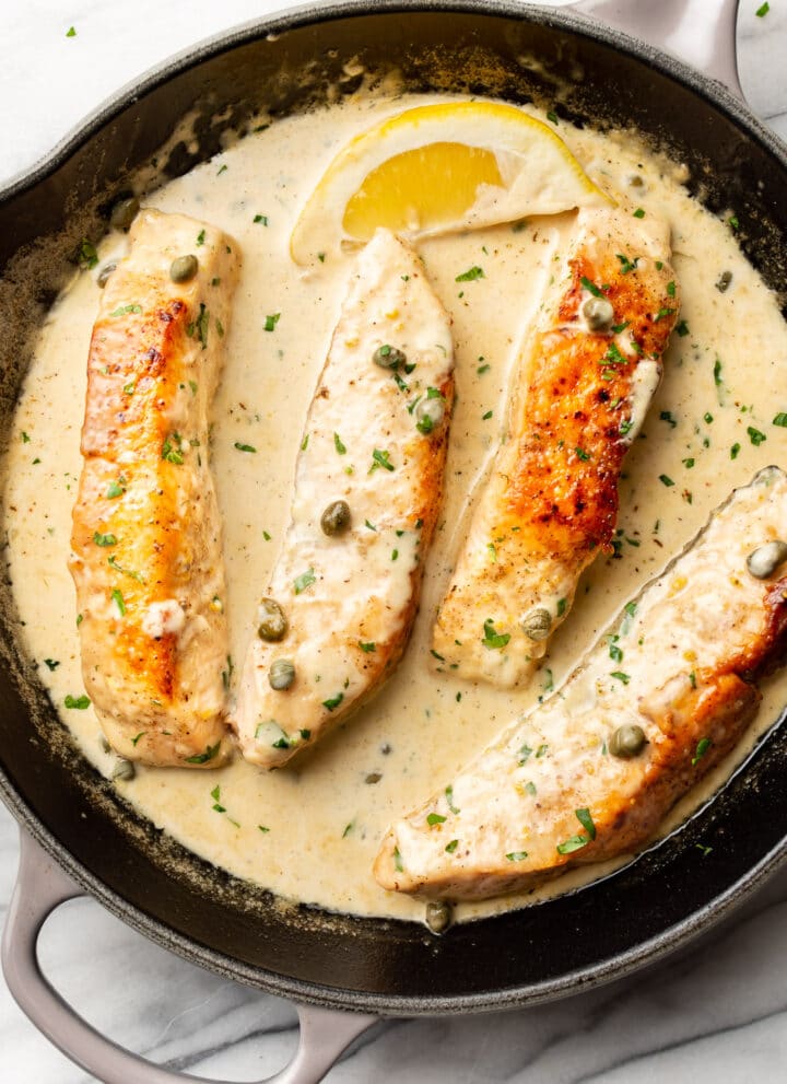 salmon piccata in a cast iron pan