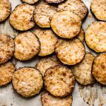 Easy baked parmesan zucchini chips with garlic and balsamic vinegar. A delicious roasted zucchini side dish. These little bites are a delicious low-carb keto snack!
