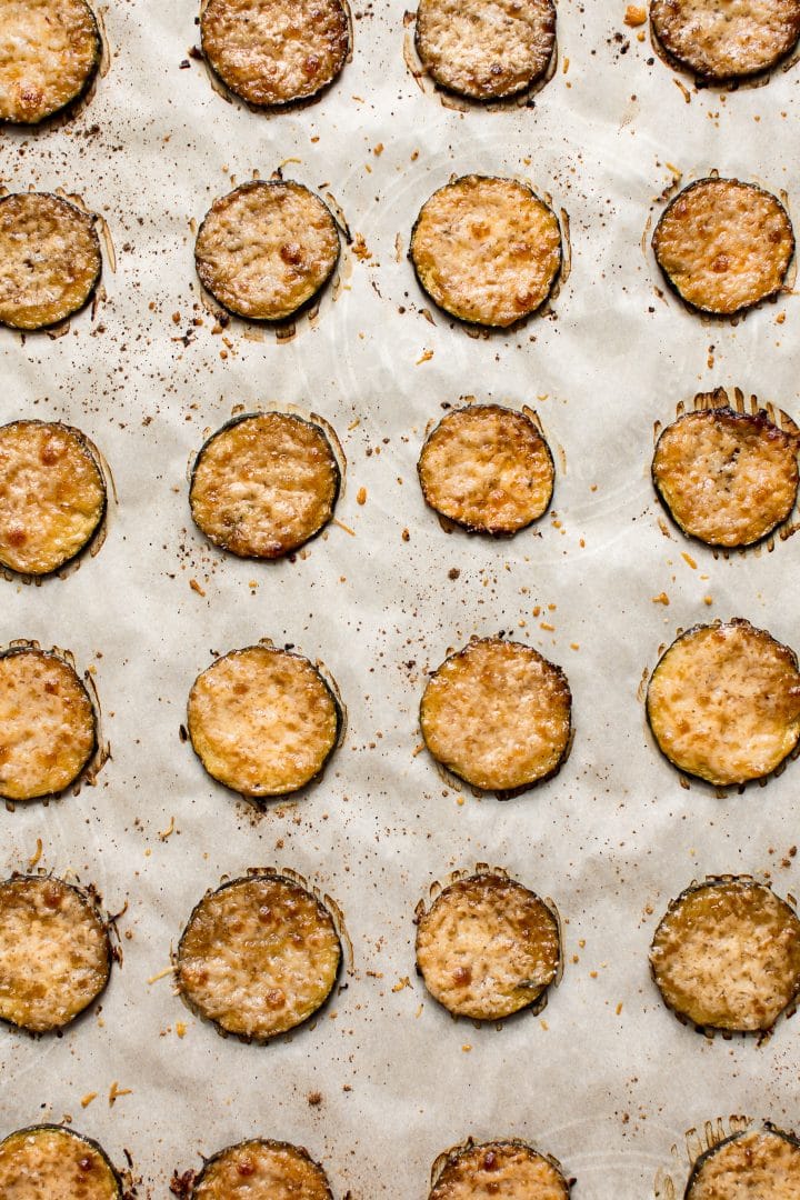 keto balsamic parmesan roasted zucchini bites lined up on a baking sheet