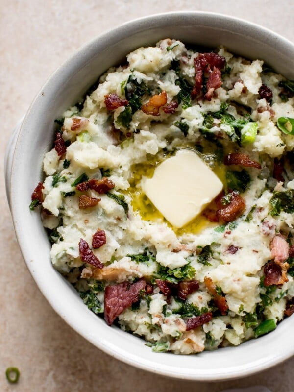 This easy colcannon recipe is a traditional Irish side dish that's a great addition to your St. Patrick's Day table.  This version is with kale (or use cabbage) and bacon! Serve with plenty of butter.