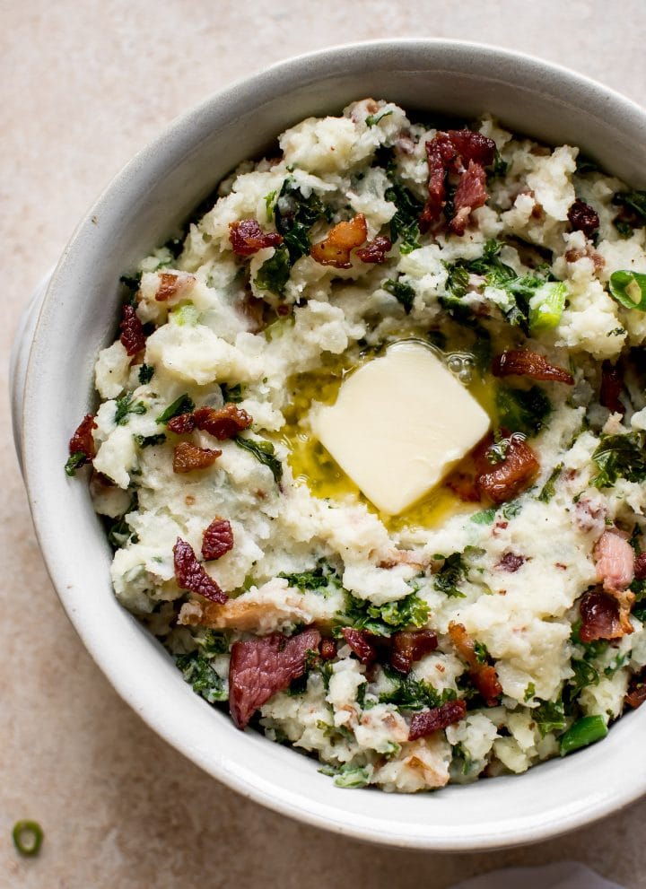 This easy colcannon recipe is a traditional Irish side dish that's a great addition to your St. Patrick's Day table.  This version is with kale (or use cabbage) and bacon! Serve with plenty of butter.