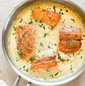 This salmon in a creamy Dijon mustard sauce is a simple comfort food dinner! This recipe can be made with either white wine or chicken broth.