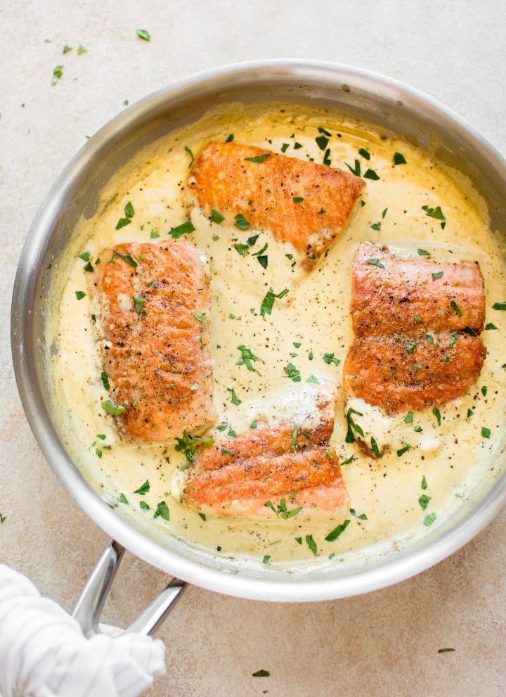 This salmon in a creamy Dijon mustard sauce is a simple comfort food dinner! This recipe can be made with either white wine or chicken broth. 