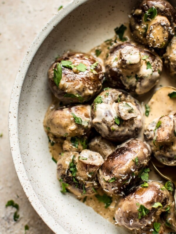 These creamy garlic mushrooms are seared until they're golden brown and then cooked in a mouthwatering cream sauce. A simple low-carb comfort food side dish that's ready in less than 20 minutes!