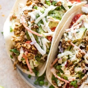 These ground pork tacos with apple slaw have a delicious seasoning mix that will make Taco Tuesday even better! The perfect easy dinner for meat lovers.